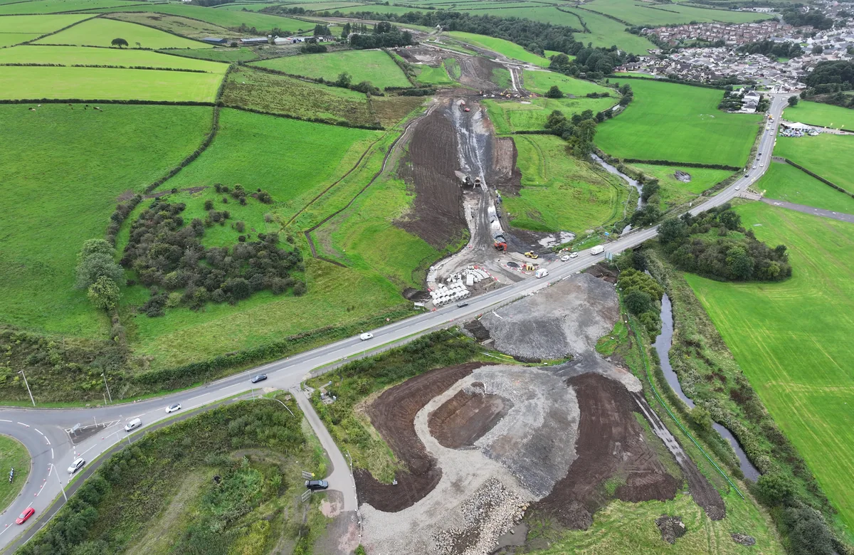 Road development works across farmland